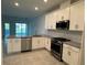 Modern kitchen features granite counters, stainless steel appliances, and ample cabinet space at 18044 Cherished Loop, Bradenton, FL 34211