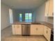 Beautiful kitchen featuring granite countertops, stainless appliances, and white cabinets at 18044 Cherished Loop, Bradenton, FL 34211