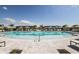 Large community pool with ample seating areas, providing a perfect spot for recreation and socializing at 18044 Cherished Loop, Bradenton, FL 34211