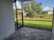 Relaxing screened patio features stone pavers and views of a lush backyard at 18044 Cherished Loop, Bradenton, FL 34211