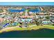 Aerial view of community with lakefront properties, clubhouse, and community pool at 19921 Petrino St, Venice, FL 34293
