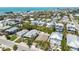 Breathtaking aerial view of coastal homes and beach, showcasing proximity to the ocean at 214 Palm Ave, Anna Maria, FL 34216
