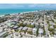 Scenic aerial view of a coastal neighborhood, showcasing the homes close to the beach at 214 Palm Ave, Anna Maria, FL 34216
