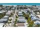 Beautiful aerial view featuring a home with a pool near the beach and local shops at 214 Palm Ave, Anna Maria, FL 34216