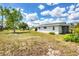 Residential lot featuring a large backyard with lush greenery and ample space at 22209 Breezeswept Ave, Port Charlotte, FL 33952