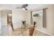 Breakfast nook with a glass table, four chairs, and a window with natural light at 22209 Breezeswept Ave, Port Charlotte, FL 33952