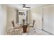 Bright dining area with modern glass table and tan tile flooring at 22209 Breezeswept Ave, Port Charlotte, FL 33952