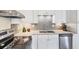 Well-lit kitchen with stainless steel appliances and granite countertops at 22209 Breezeswept Ave, Port Charlotte, FL 33952