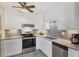 Well-lit kitchen with stainless steel appliances and granite countertops at 22209 Breezeswept Ave, Port Charlotte, FL 33952