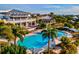An aerial view showing the large community pool, clubhouse, and patio at 319 Compass Point Dr # 201, Bradenton, FL 34209