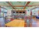 Stylish bar area featuring a long countertop, barstools, pendant lights, and ample seating at 319 Compass Point Dr # 201, Bradenton, FL 34209