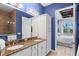 Bathroom with double sinks, granite counters and views to the main bedroom at 319 Compass Point Dr # 201, Bradenton, FL 34209