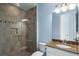 Bathroom features granite countertop and large shower with glass doors at 319 Compass Point Dr # 201, Bradenton, FL 34209