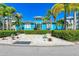 Charming blue clubhouse surrounded by lush landscaping, enhancing curb appeal and community atmosphere at 319 Compass Point Dr # 201, Bradenton, FL 34209