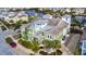 Inviting two-story home boasting lush landscaping, complemented by mature palm trees and pristine sidewalks at 319 Compass Point Dr # 201, Bradenton, FL 34209