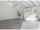Clean garage space with an open layout, a water heater, and storage racks for organized living at 319 Compass Point Dr # 201, Bradenton, FL 34209