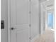 Hallway showing elevator access with light colored wood floors at 319 Compass Point Dr # 201, Bradenton, FL 34209
