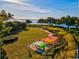 Expansive lawn area with colorful kayaks ready for outdoor recreation and enjoying the waterfront location at 319 Compass Point Dr # 201, Bradenton, FL 34209
