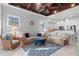 Inviting living room features vaulted wood-paneled ceiling, comfortable seating and bar access at 319 Compass Point Dr # 201, Bradenton, FL 34209