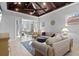 Bright living room featuring vaulted wood-paneled ceiling, comfortable seating and access to sunroom at 319 Compass Point Dr # 201, Bradenton, FL 34209