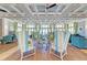 Elegant lounge area with high ceilings, stylish seating, and large windows with ocean views at 319 Compass Point Dr # 201, Bradenton, FL 34209