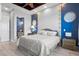 Serene main bedroom with a king bed, blue accent wall, and decorative wall art at 319 Compass Point Dr # 201, Bradenton, FL 34209