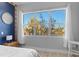 Bright main bedroom with three large windows providing expansive water views at 319 Compass Point Dr # 201, Bradenton, FL 34209
