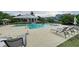 Inviting pool area with lounge chairs, umbrellas, and well-maintained paving for relaxing and socializing at 319 Compass Point Dr # 201, Bradenton, FL 34209