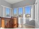 Bright staircase landing with wood railing and many windows providing ample natural light and scenic views at 319 Compass Point Dr # 201, Bradenton, FL 34209