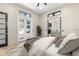 Bedroom with french doors leading to an outdoor area and a view into a living room at 324 Siesta Dr, Sarasota, FL 34242