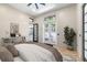 Bedroom featuring stylish light colored tile floors, a workspace, and a view to the outdoors at 324 Siesta Dr, Sarasota, FL 34242