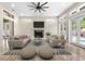 Sophisticated living room featuring high ceilings, a fireplace, and elegant furnishings at 324 Siesta Dr, Sarasota, FL 34242
