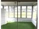 Bright sun room featuring a ceiling fan, and large windows with a view of the outdoors at 3321 Fuller St # 105, Sarasota, FL 34231