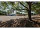 Expansive property with well-maintained grounds, ample parking, and mature trees at 3402 Key Ave, Sarasota, FL 34239