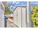 Storage shed with double doors, conveniently located in the backyard for tools and equipment at 3402 Key Ave, Sarasota, FL 34239