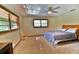 Bedroom features carpet, natural light, two windows with blinds, neutral walls, and ceiling fan at 3406 67Th Street E Ct, Bradenton, FL 34208