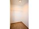 Walk-in closet offers carpet floors and a single wire shelving unit for storage at 3406 67Th Street E Ct, Bradenton, FL 34208