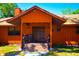 Charming home featuring a covered front porch, wood exterior, and double doors, creating a welcoming entrance at 3406 67Th Street E Ct, Bradenton, FL 34208