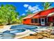 This backyard oasis boasts a sparkling pool and hot tub, perfect for relaxation and entertainment in a peaceful setting at 3406 67Th Street E Ct, Bradenton, FL 34208