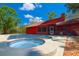 This backyard features a sparkling pool and integrated hot tub with screened in porch and is perfect for outdoor relaxation at 3406 67Th Street E Ct, Bradenton, FL 34208