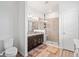 Bathroom featuring a granite vanity, modern fixtures, and a large glass shower at 3478 74Th Avenue E Cir, Sarasota, FL 34243