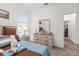 Bedroom with a large window, bedside table, and dresser at 3478 74Th Avenue E Cir, Sarasota, FL 34243