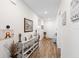 Inviting hallway featuring wood-look floors and tasteful decor at 3478 74Th Avenue E Cir, Sarasota, FL 34243