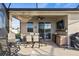 Outdoor patio area includes comfortable seating, a built-in bar, and views of the pool and beyond at 3478 74Th Avenue E Cir, Sarasota, FL 34243
