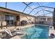 Inviting screened-in pool with sun loungers for relaxing and enjoying the outdoor space at 3478 74Th Avenue E Cir, Sarasota, FL 34243