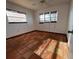 Bedroom with tile floors, three windows with blinds, and neutral walls at 3705 Chinaberry Rd, Bradenton, FL 34208