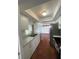 Kitchen highlighting stainless steel appliances, marble countertops, with terracotta floors and recessed lighting at 3705 Chinaberry Rd, Bradenton, FL 34208