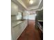 Bright kitchen featuring marble countertops, stainless steel appliances, and terracotta tile flooring at 3705 Chinaberry Rd, Bradenton, FL 34208