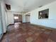 Large sunroom with sliding glass doors and red tiled floors at 3705 Chinaberry Rd, Bradenton, FL 34208
