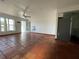 Open living area with terracotta tile floors, bright walls, and convenient access to adjacent rooms at 3705 Chinaberry Rd, Bradenton, FL 34208